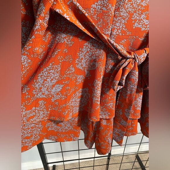 Unbranded women’s floral long sleeve rust colored romper NWOT - Picture 3 of 10